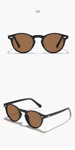Close-up of retro round frame sunglasses in black finish featuring brown tinted lenses.