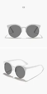 Detailansicht der weißen halbrandlosen runden Kinder-Sonnenbrille mit grauen Gläsern