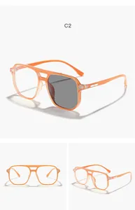 Detailed view of kids orange aviator glasses featuring functional photochromic lenses