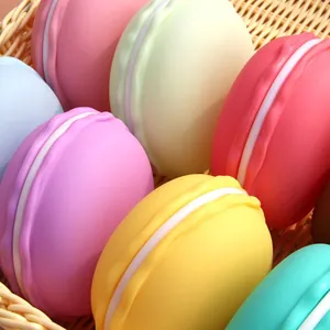 Colorful macaron shaped jewelry storage boxes neatly arranged in a woven wicker basket