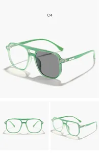 Detailed macro view of light green children's aviator glasses showing lens transition
