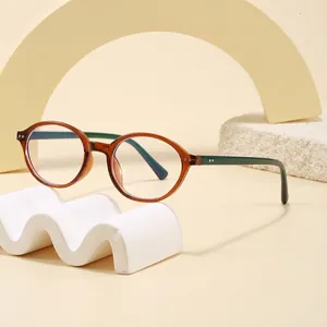 Stylish retro oval brown frame and green temple anti-blue light glasses for students