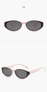 Detail view of pink cat-eye sunglasses for kids featuring UV400 protective lenses
