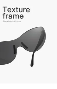 Close-up of frameless cat-eye sunglasses with dark gradient lenses and textured frame.