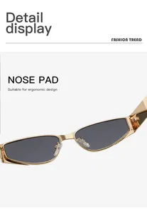 Detailed view of the ergonomic nose pads on these narrow gold metal frame sunglasses