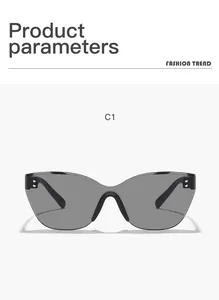 Detailed front view of black rimless cat-eye sunglasses with silver rivet accents