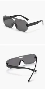 Professional detail view of rimless aviator one-piece sunglasses with grey lens