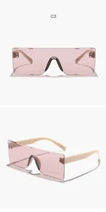Gafas de sol rectangulares sin montura con lentes rosas y patillas de color beige