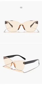 Detailed two-angle view of rimless irregular cat-eye sunglasses with amber lenses