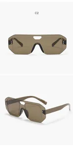 Detailed view of oversized brown rimless shield sunglasses from front and side angles