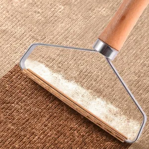 Manual portable lint remover with wooden handle for fabric and clothing maintenance