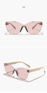 Stylish rimless cat-eye sunglasses with pink lenses and cream-colored quilted temples