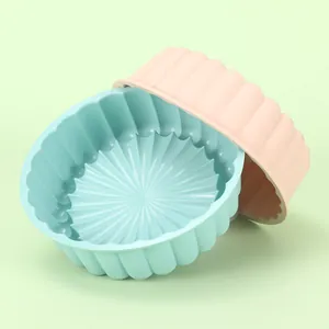 Set of two round 8-inch silicone air fryer liners in pastel green and pink for baking