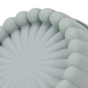 Close-up shot of an 8-inch heat-resistant silicone air fryer liner with radial pattern