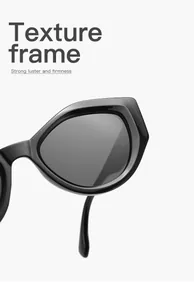 Close-up of gloss black cat-eye sunglasses with thick texture frame