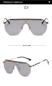 Front and side view of oversized grey shield sunglasses with gold metal frame