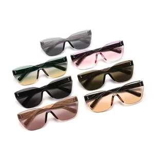 Collection of various rimless cat-eye sunglasses with colorful lenses and rivet details