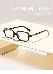 Close-up of black square frame glasses with anti-blue light lenses and gold accents