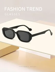 Detailed view of black retro rectangular sunglasses on geometric pedestals.