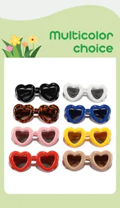 A multicolor display of kids heart-shaped sunglasses in vibrant and vintage colors