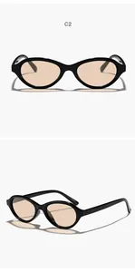 Front and side view of retro black oval sunglasses with light amber colored lenses