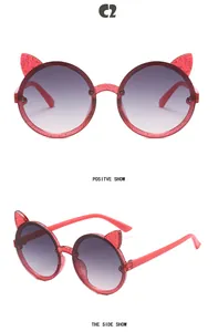 Side and front views of girls pink glittery cat ear sunglasses with round purple lenses