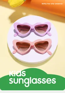 Close-up of candy-colored heart-shaped sunglasses for kids in pink and purple.