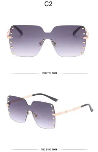 Front and side views of oversized rimless sunglasses with gold rivets and purple gradient lenses