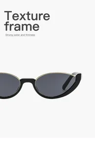 Detailed macro view of black cat-eye sunglasses with textured metallic half-frame edge