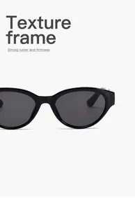 Gedetailleerde weergave van een retro cat-eye zonnebril met glanzende zwarte montuur