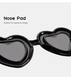 Detailed macro view of ergonomic integrated nose pad on heart-shaped children sunglasses