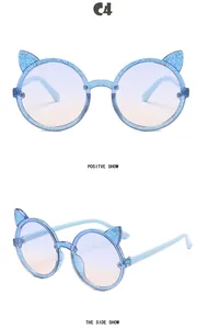 Detailed front and side views of blue glitter cat-ear round sunglasses for kids