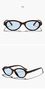 Detail view of retro oval tortoiseshell sunglasses with light blue lenses for women