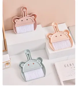 Collection of cute bear-shaped mini desktop broom and dustpan sets in various soft pastel colors