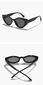 Close-up macro view of black irregular cat-eye sunglasses from two different angles