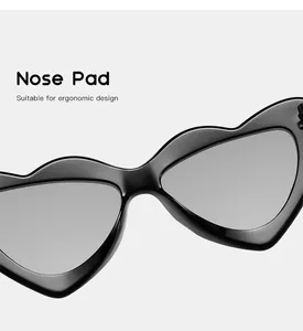 Macro detail view of the ergonomic nose pad design on black kids heart-shaped sunglasses