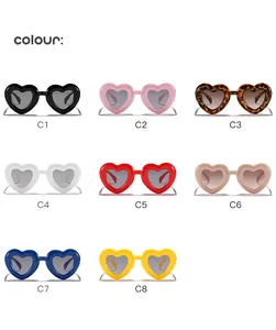 Grid layout showing eight vibrant color options of retro heart-shaped children's sunglasses