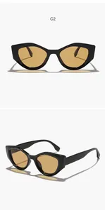 Detail view of vintage polygonal cat-eye sunglasses with yellow lenses and black frame