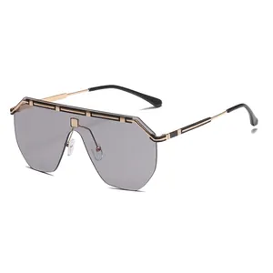 Trendy oversized shield sunglasses with gold metal frame and gray tinted lenses.