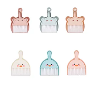 Cute bear and duck mini desktop dustpan and brush sets in pink, blue, and beige.