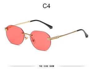 Detailansicht Damen randlose Sonnenbrille mit rosa Ozeangläsern und goldenen Bügeln