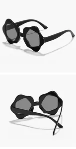 Multiple views of children's flower-shaped sunglasses with black irregular frames