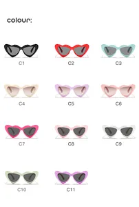 Collection of candy-colored heart-shaped children's sunglasses in eleven color variants.