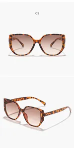 Detail view of oversized square leopard print sunglasses with gradient lenses.