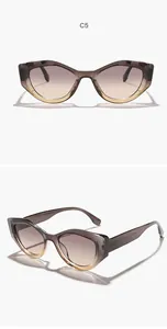 Detailed view of vintage irregular cat-eye sunglasses with gradient brown lenses.