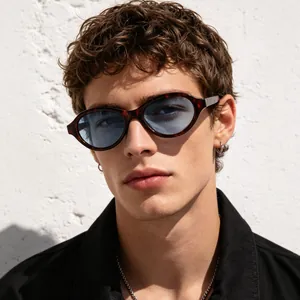 Retro oval tortoiseshell sunglasses with light blue tinted lenses for a vintage style