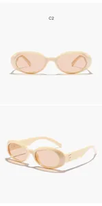 Retro oval sunglasses with cream frames and peach lenses, front and side views shown.