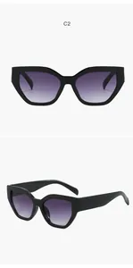 Vista dettagliata degli occhiali da sole cat-eye di tendenza con lenti sfumate viola