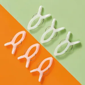 Durable set of windproof plastic quilt clips in pink and white for laundry drying