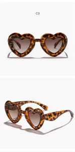 Macro view of heart-shaped leopard print sunglasses for children with UV protection